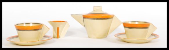 A fabulous Art Deco Clarice Cliff Stamford shape bachelors tea set, decorated in concentric