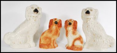 A large pair of circa 19th century Staffordshire Spaniels ( dogs ) of typical form together with