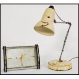 A vintage retro 20th century Diamond clock along with a vintage anglepoise type desk lamp on