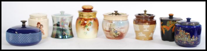 A collection of 20th century vintage tobacco jars to include a Royal Doulton salt glazed jar with