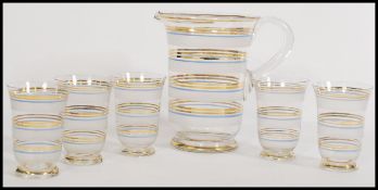 An early 20th Century vintage frosted and clear glass lemonade set to include glasses and pitcher