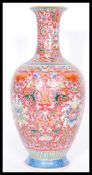 A Chinese Qianlong mark porcelain vase having fine enamel detailing on red ground. Hand decorated