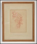 A red chalk drawing depicting a man carrying a small child by Frank Brangwyn RA (1867-1956), an