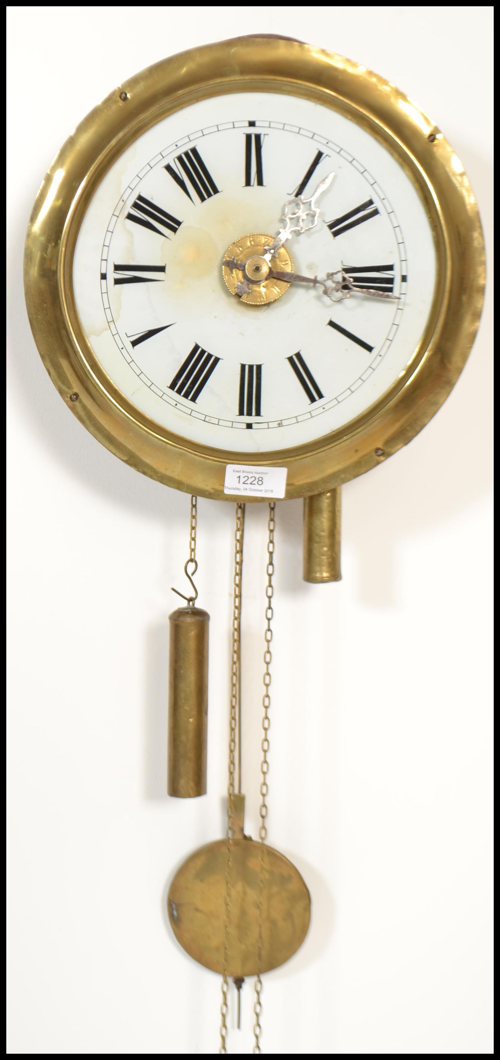 A 19th century Victorian postman's clock, outer polished brass casing, Roman numeral chapter ring