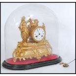 A 19th century French 8 day mantel clock having cylinder 8 day movement in gilt figural body being