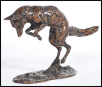 A cold cast bronze sculpture of a hunting fox mid motion by Lucy Kinsella, being a limited edition