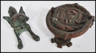 A Dutch bronze door knocker with latin notation together with an English bronze door knocker in