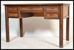 An early to mid 20th Century oak writing table des
