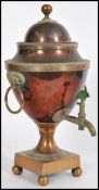 A late 19th century Victorian copper and brass Samavar having a finial lid, with twin ram head