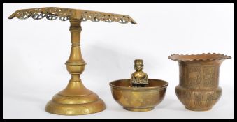 A selection of brass items to include a prayer bowl / butter dish featuring a man and child figure
