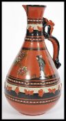 Attributed to Christopher Dresser (1834-1904) for Watcombe Pottery, Torquay pottery, a tall ewer jug