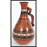 Attributed to Christopher Dresser (1834-1904) for Watcombe Pottery, Torquay pottery, a tall ewer jug