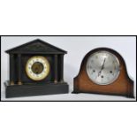 A late Victorian black slate mantel clock of architectural form together with a 1930's Art Deco