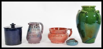 A selection of C. H. Brannam north Devon wares to include a small ink pot with a floral design