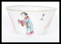 A mid 19th century Chinese porcelain Wu Shuang Pu wine cup having hand painted decoration with