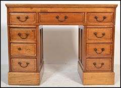 A 20th century Chinese hardwood twin pedestal desk having a configuration of two banks of four