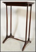 A 19th century Victorian mahogany planter table raised on tapering legs with inset brass tray.