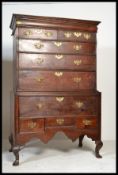 A George III oak chest on chest of drawers on stan