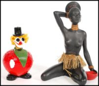 A vintage retro 20th Century studio art glass figure modelled as a clown by Murano, the body of