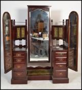 A Victorian mahogany Art Nouveau drop centre bat wing dressing table. The pedestals flanking a