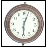 A vintage mid 20th Century Smiths bakelite station / factory wall clock, roman numeral chapter