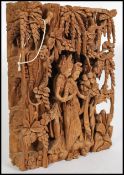 A decorative large 20th century hand carved hardwood Balinese - Asiatic wooden carving of lovers