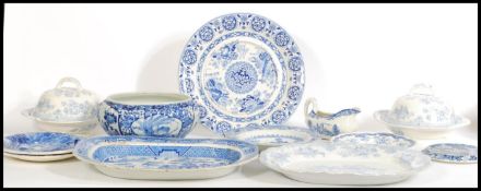 A collection of 19th century blue and white china to include meat plates, Spode charger, tureens