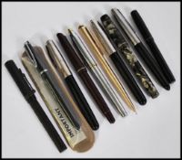 A collection of vintage fountain / lever / ink pens to include a Waterman Skywriter ( 14k nib ), The