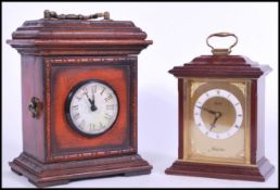 A 20th century mahogany cased mantel  / bracket clock with decorative bracket style case, handle
