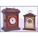 A 20th century mahogany cased mantel  / bracket clock with decorative bracket style case, handle