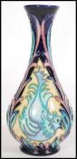 Moorcroft - Kerri Goodwin. A tubelined decorated baluster vase hand painted and decorated in the