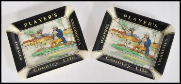 A pair of unusual early 20th century ceramic cigarette advertising ashtrays for Player's Country