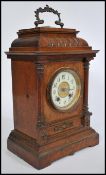 A 19th century HAC oak cased mantel clock having decorative oak case inset brass movement stiking on