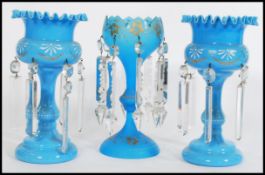 A 19th century Victorian garniture of blue glass lustres, to include two matching with with fanned