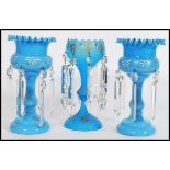 A 19th century Victorian garniture of blue glass lustres, to include two matching with with fanned