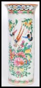 A 19th century Chinese Canton enamel tall cylindrical vase having a flared rim. Hand decorated