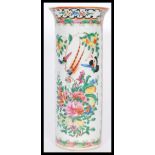 A 19th century Chinese Canton enamel tall cylindrical vase having a flared rim. Hand decorated