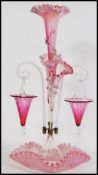 A 19th century Victorian glass epergne centre piece, having a central trumpet with a frilled rim