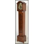 A good quality walnut cased tempus fugit grandmother clock. The walnut trunk and hood with inset