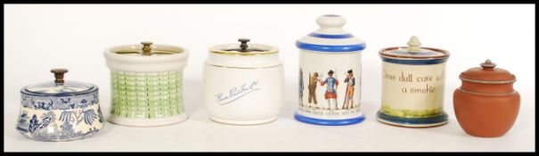 A selection of vintage tobacco jars to include a hand painted cockerel jar with 'Drive dull care