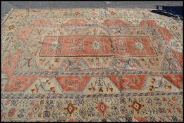 A large 20th century Persian Islamic rug with a cr