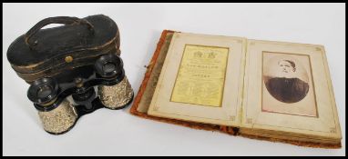 A 19th century Victorian photograph album containing portrait photographs along with a pair of