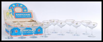 A boxed set of six retro 20th century point of sale advertising Babycham glasses, the circular