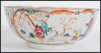 An 18th / 19th century Chinese famille rose fruit bowl painted with decorative scenes of family