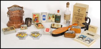 A collection of vintage items to include playing cards, vintage perfume bottles, compact, table