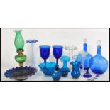 A collection of 19th century Victorian green and blue glass wares to include a green glass and brass