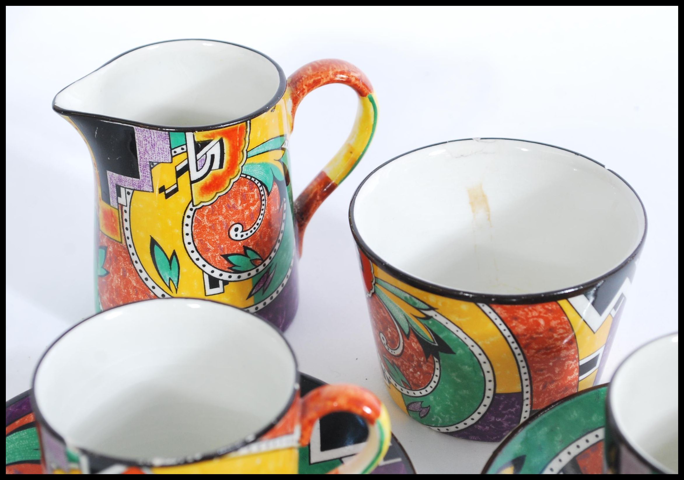 A retro vintage chine tea service with a coloured geometric shape pattern, to include six cups and - Image 5 of 6