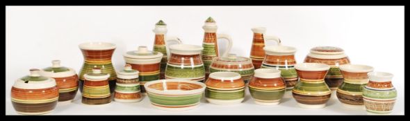 A collection of Wales pottery stamped 'Dragon Pottery Rhayader' to include small vases, sugar pots