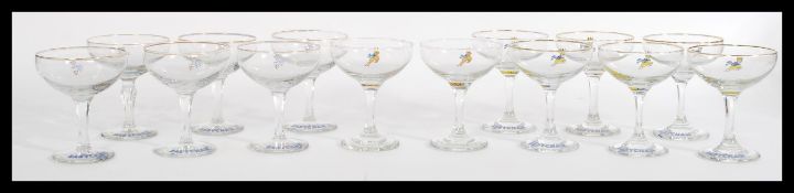 A collection of fourteen vintage 20th Century advertising point of sale glasses for Babycham, to