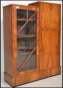 A 1930's Art Deco walnut bureau bookcase. The display cabinet bookcase being flanked by a fall front